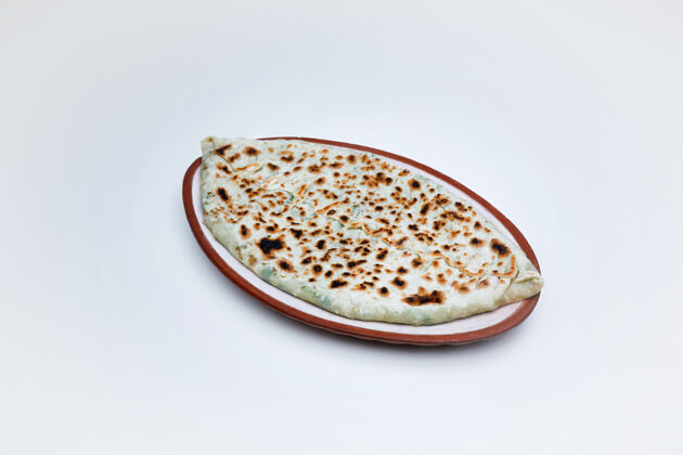 自制从artsakhZingyalov帽子传统亚美尼亚菜特写镜头热的午餐面包