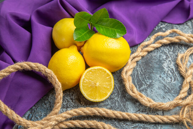柠檬前视图新鲜柠檬与绳索食物颜色多汁