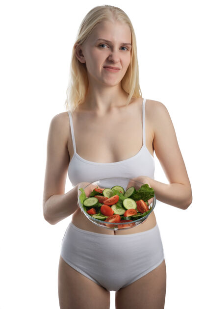 蔬菜吃健康沙拉的年轻女人膳食西红柿食物