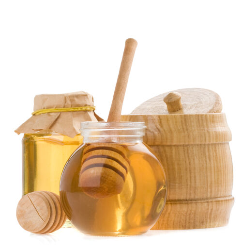 滴玻璃罐里的蜂蜜和白粘在一起果酱勺玻璃