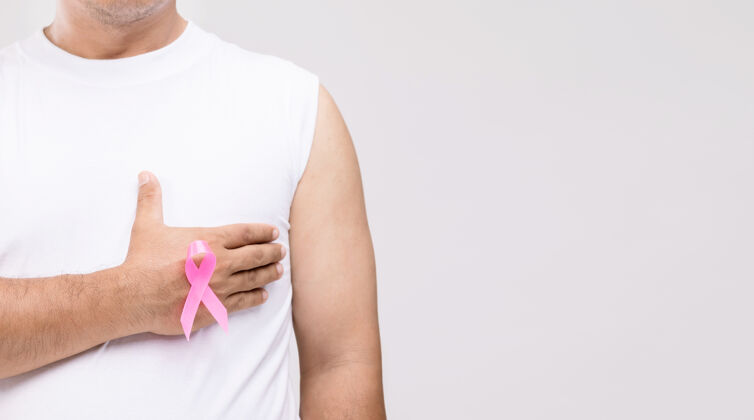 弓男性乳腺癌概念：亚洲男性肖像和粉红丝带乳腺癌运动的象征乳房医学女人