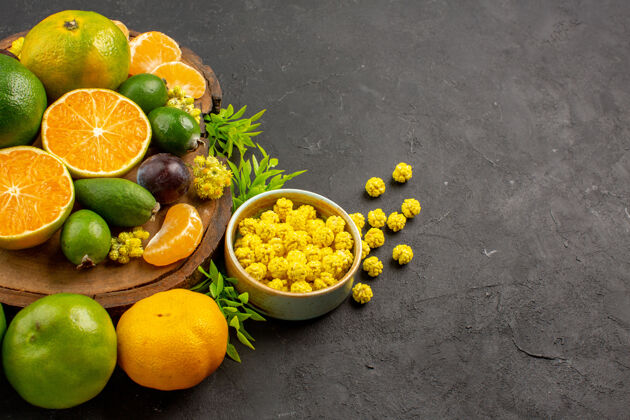 健康在黑暗的空间里看到新鲜的绿橘子和飞珠水果前柠檬