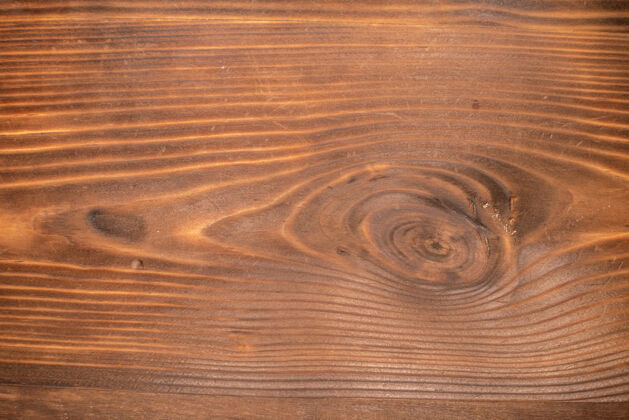 面板在棕色木质背景上俯瞰空旷的空间沙子拼花地板表面