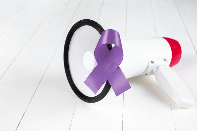 癌症11月的宣传活动特写浅蓝色丝带宣传支持癌症患者的标志意识希望保护