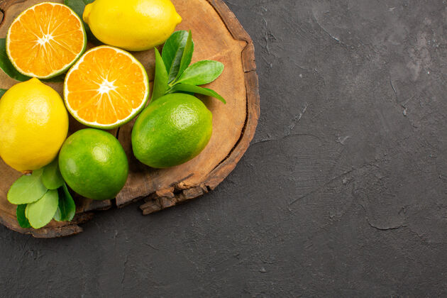 健康顶视图新鲜酸柠檬深色水果柑橘酸橙柑橘顶部食物