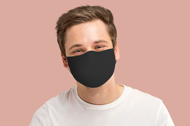 疾病Covid-19面罩美国男人脸特写前进成年布面具