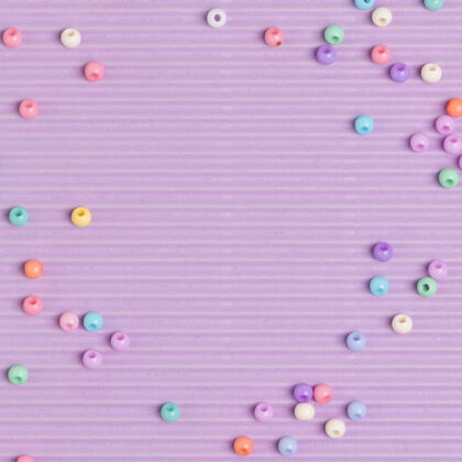 紫色背景粉彩珠子边框紫色背景波浪纸边框图案