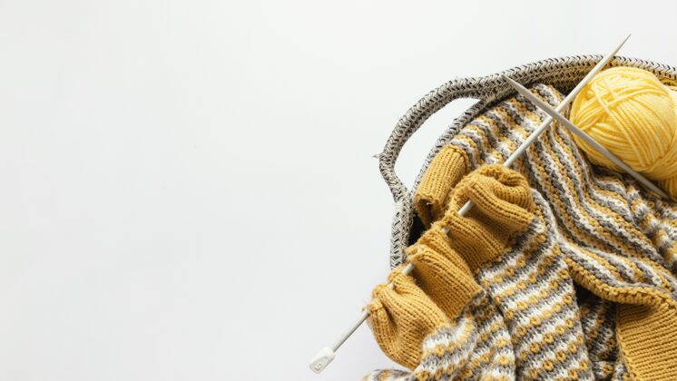 篮子编织针和毛线在篮子里有复制空间编织者羊毛纺织品